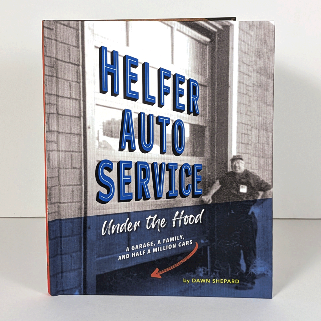 A book cover with a photo of a man standing next to a large garage door.