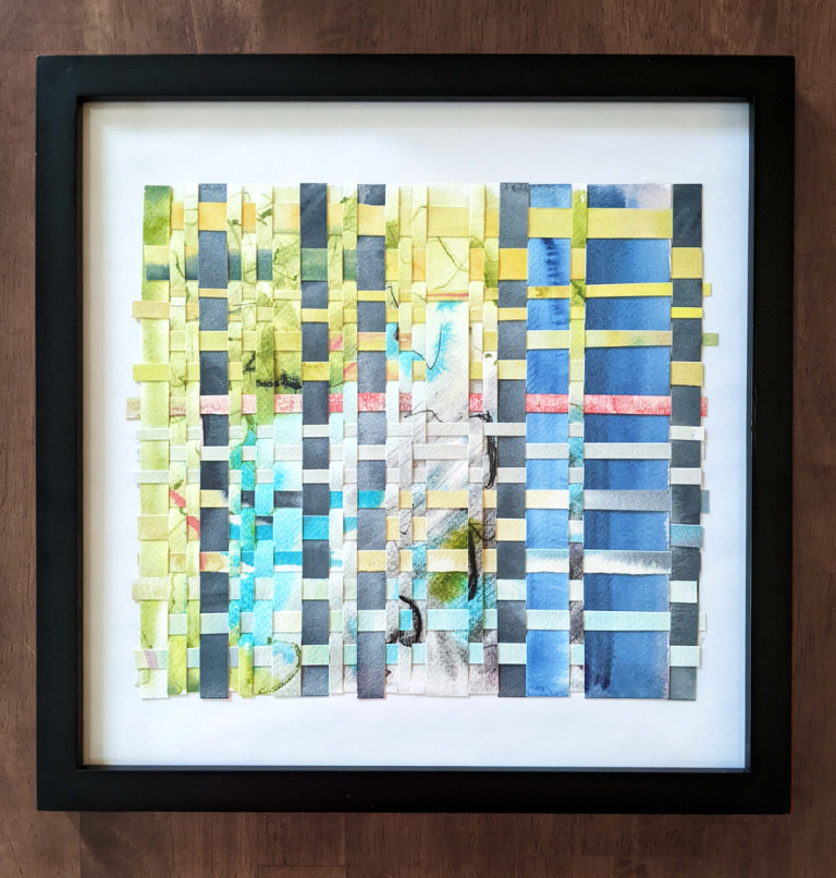 Paper weaving with blue, yellow, green, teal, and coral.